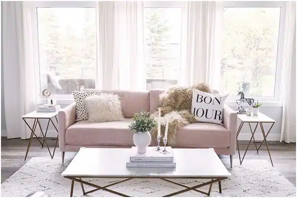 Light pink sofa and a center table.